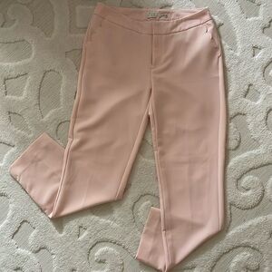 Pink ankle dress pants with scalloped pocket detail